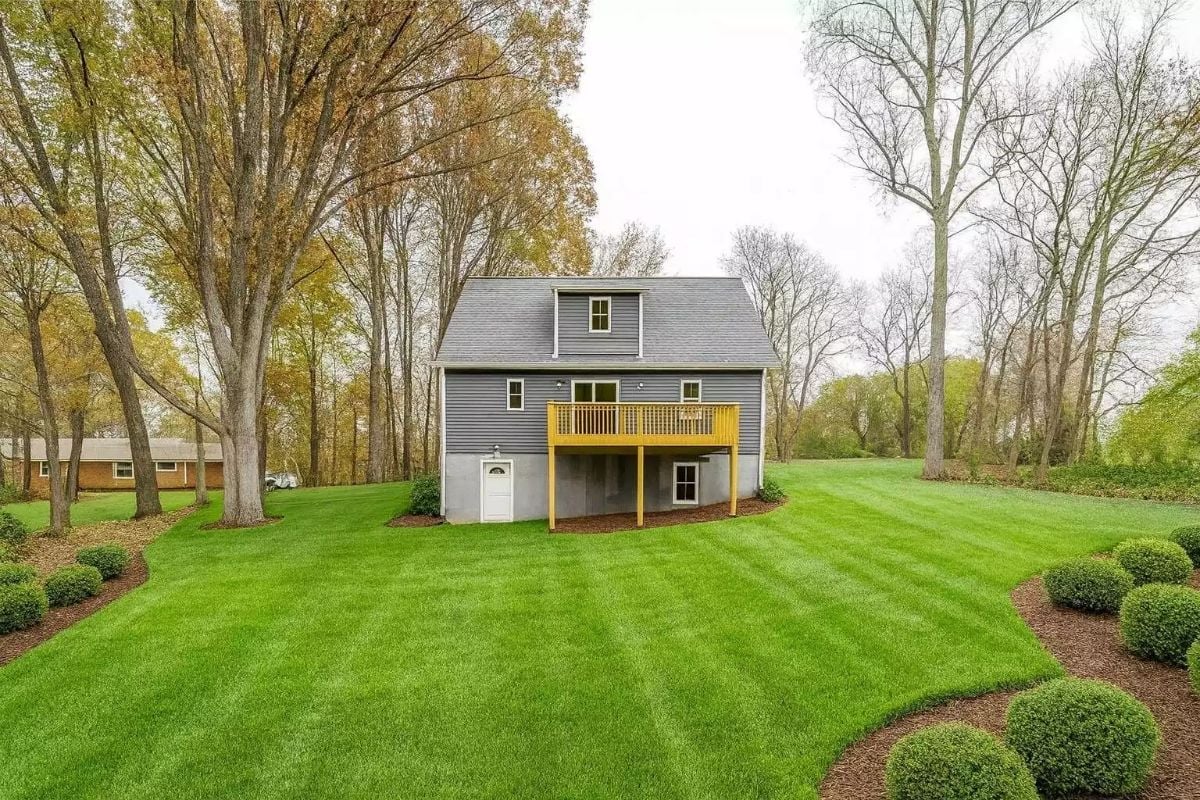 Gray Siding and a Yellow Deck That Actually Earns Attention