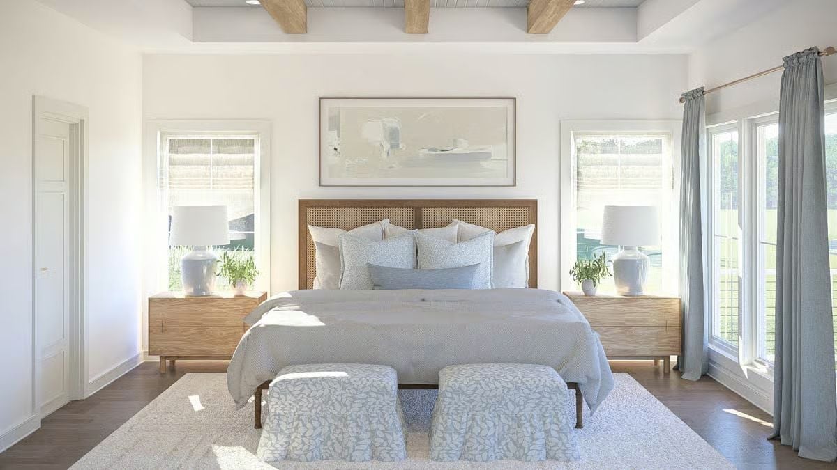 Cane Headboard and Exposed Ceiling Beams Pull Off Effortless Coastal Calm