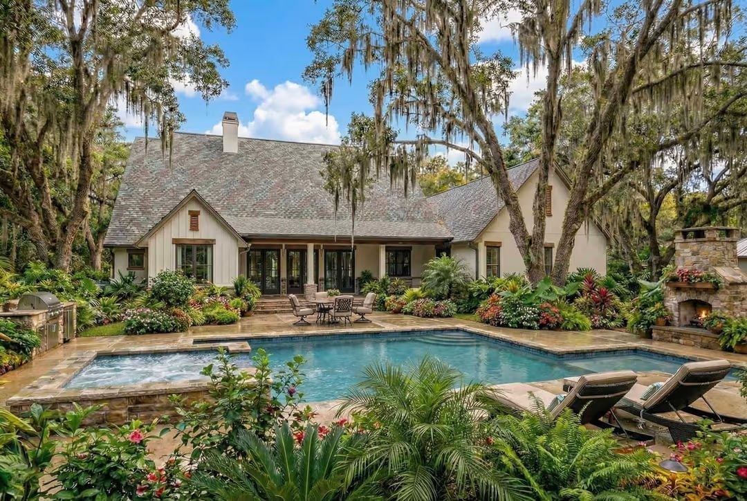 Spanish Moss, Stone Fireplace, and a Pool That Earns Every Square Foot