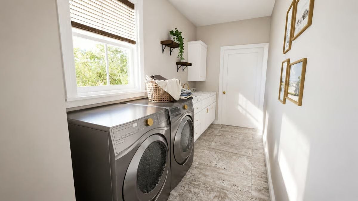 Gunmetal Appliances and Gold Knobs in a Laundry Room That Pulls Its Weight