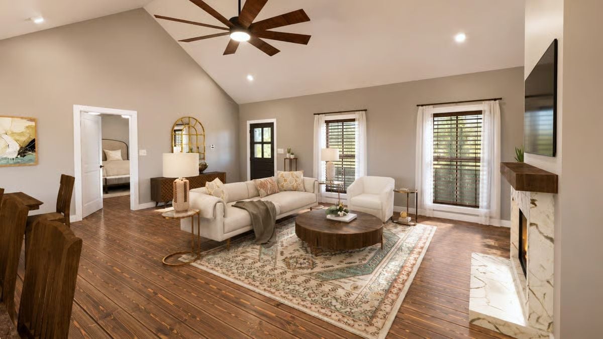 Vaulted Ceilings and a Wood Slab Coffee Table Set the Tone Early