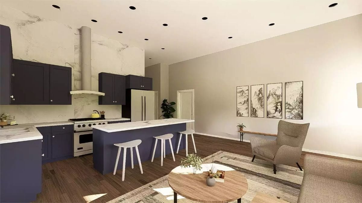 Navy Cabinetry and Marble Backsplash in an Open-Plan Kitchen