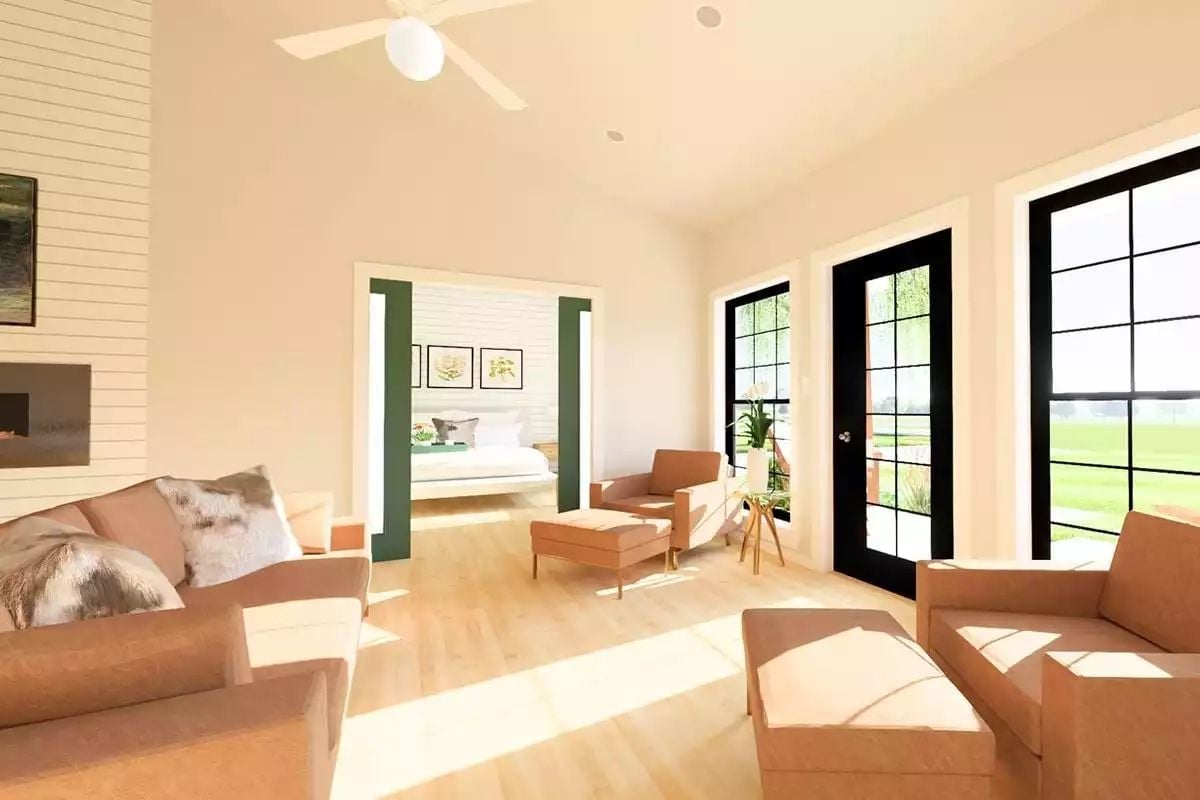Warm Neutrals and Black-Framed Doors Anchor This Sun-Drenched Living Space