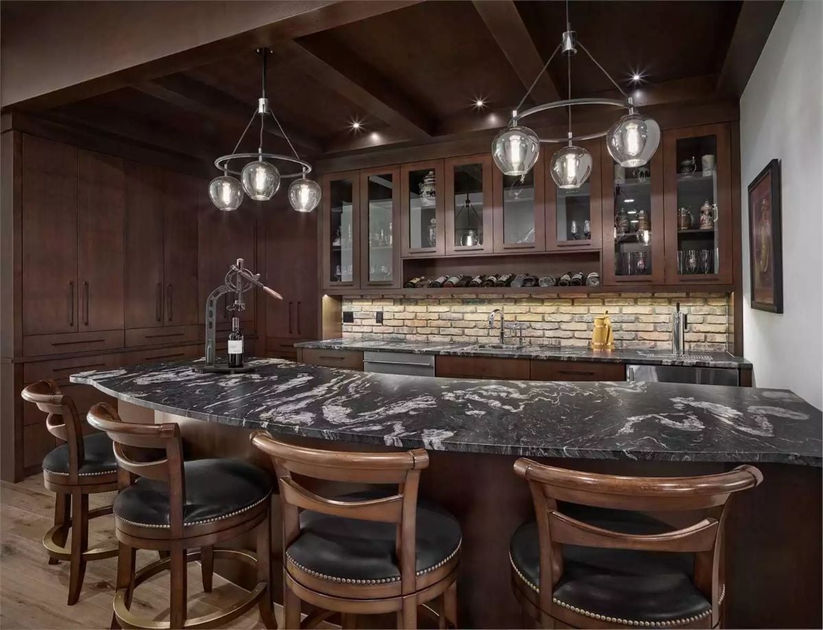 Leather Bar Stools and Brick Backsplash Pull Off Something Most Home Bars Can't