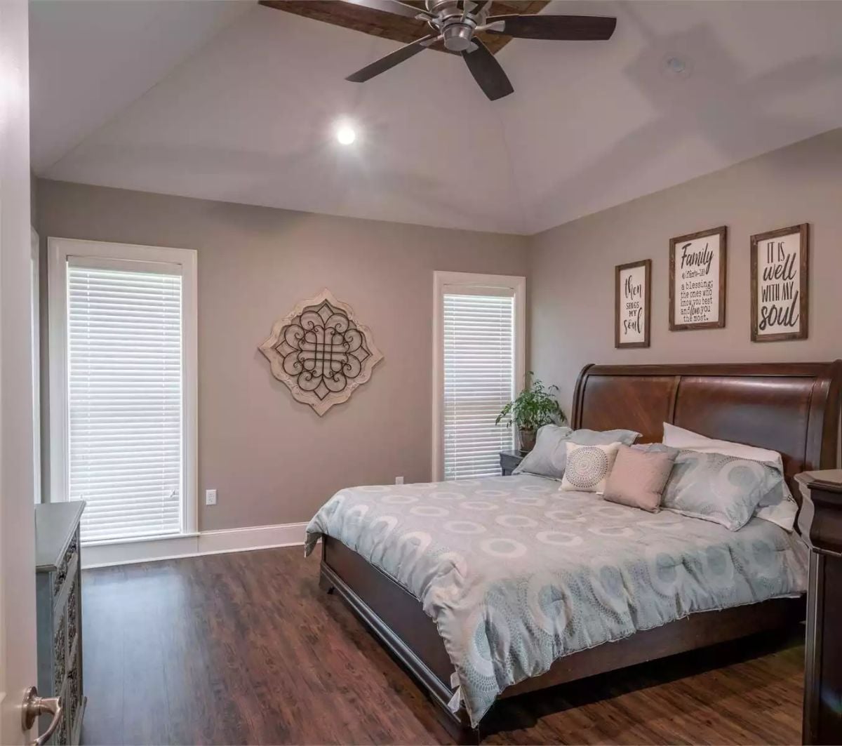 Vaulted Ceiling and Sleigh Bed Make the Master Feel Worth Coming Home To