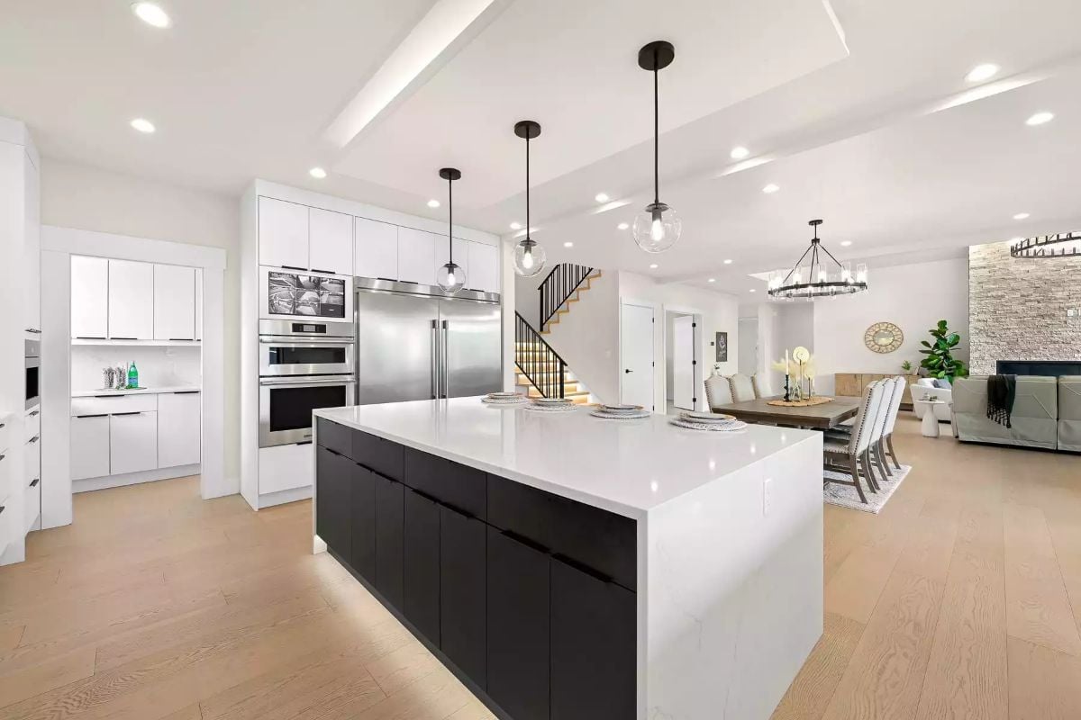 Black-and-White Island Kitchen Where Scale Does Most of the Work