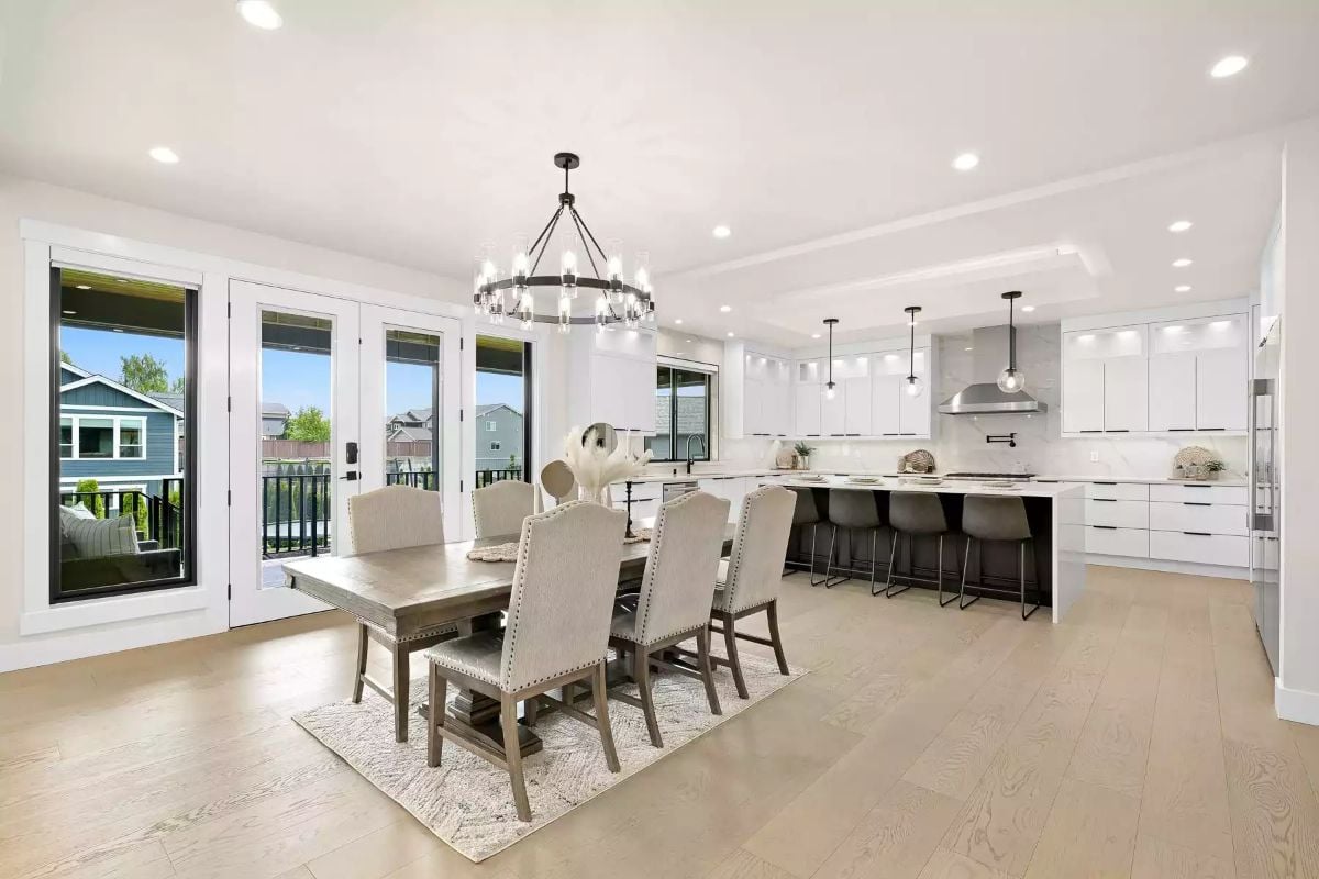 Candle-Ring Chandelier Over a Dining Table Built to Seat the Whole Family