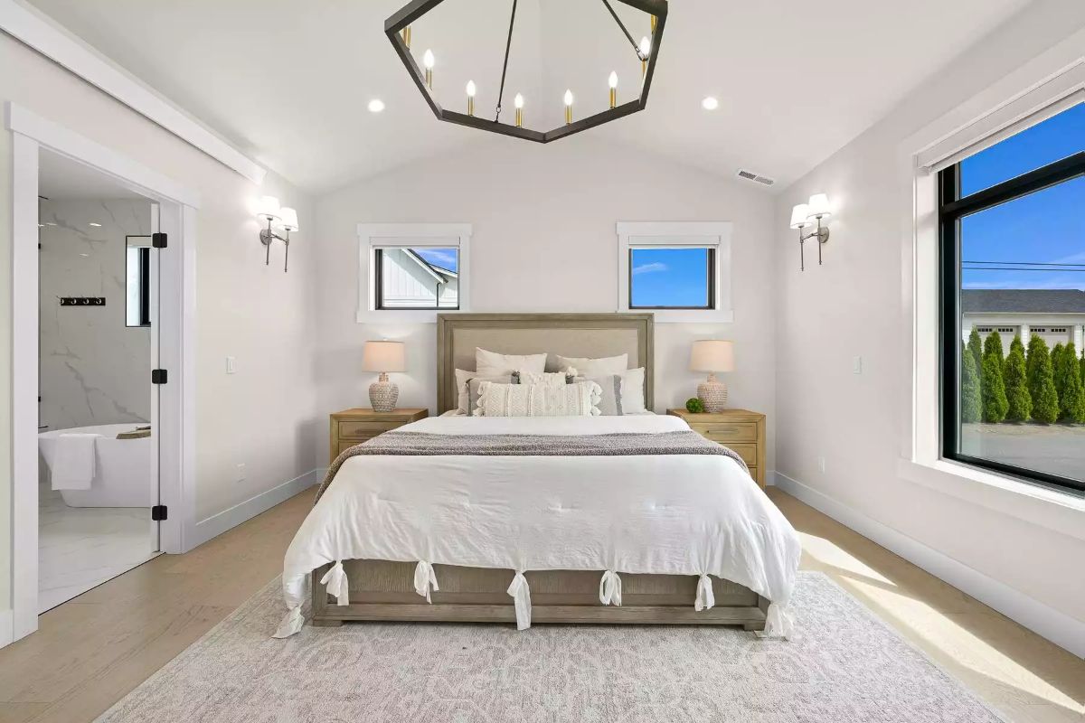 Hexagonal Chandelier Keeps a Vaulted Master Bedroom Grounded at the Center