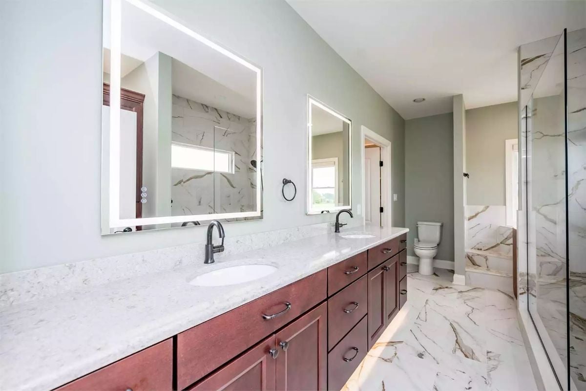 Backlit Mirrors and a Double Vanity Built for Two People Who Won't Share a Sink