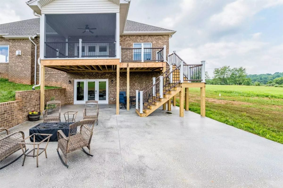 Elevated Deck, Screened Porch, and Concrete Patio Pull Triple Duty Out Back