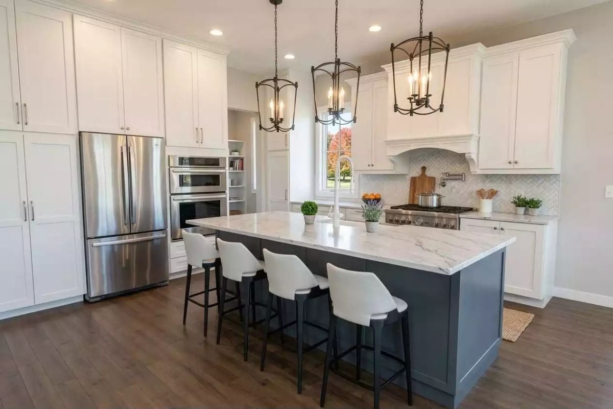 Dark Island Base Against White Cabinetry Is a Contrast Worth Copying