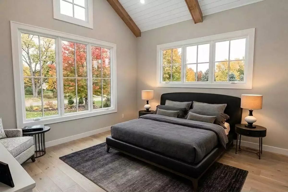 Vaulted Primary Bedroom Where the Autumn View Does Most of the Work