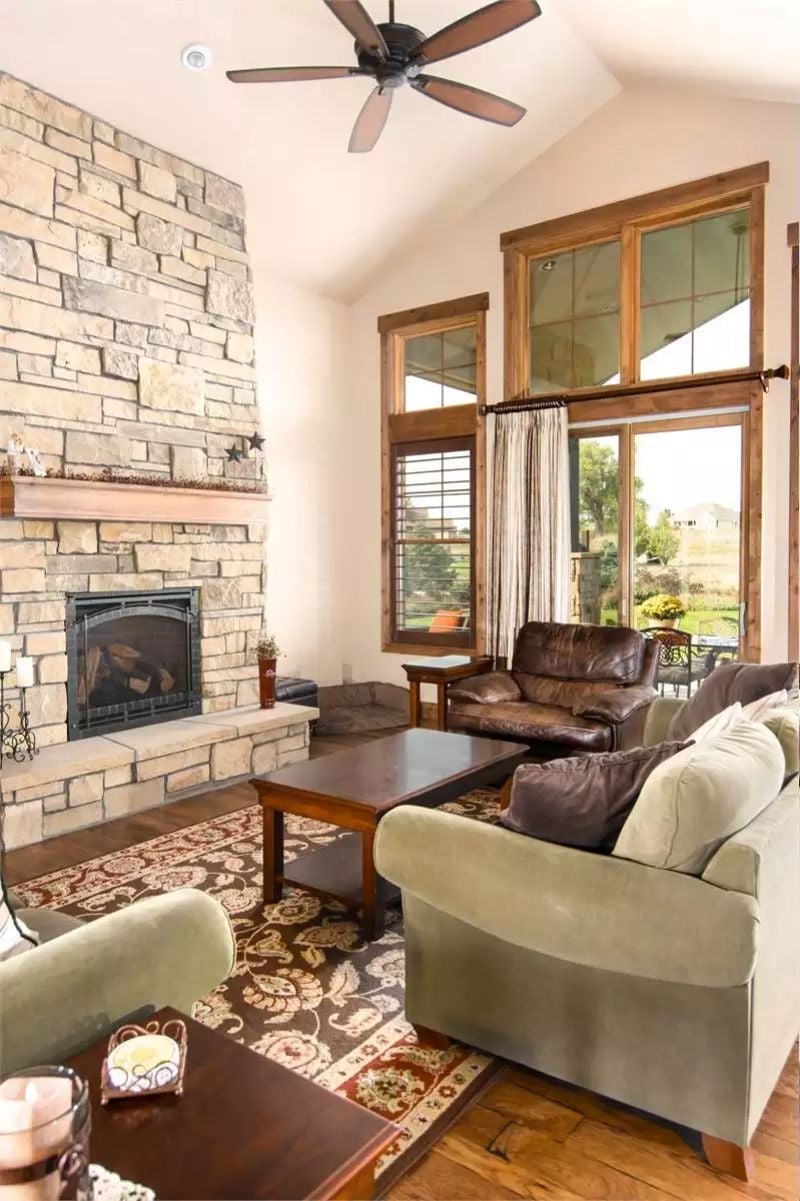 Floor-to-Ceiling Stone Fireplace Earns Every Inch of Wall It Takes