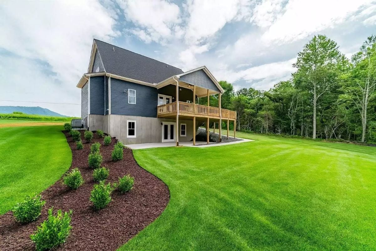 Covered Deck, Manicured Lawn, and a View Worth Building Around