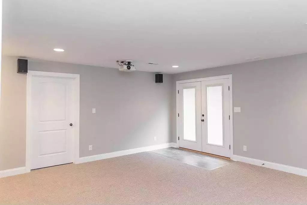 Ceiling-Mounted Projector Turns an Empty Basement Into a Dedicated Screening Room