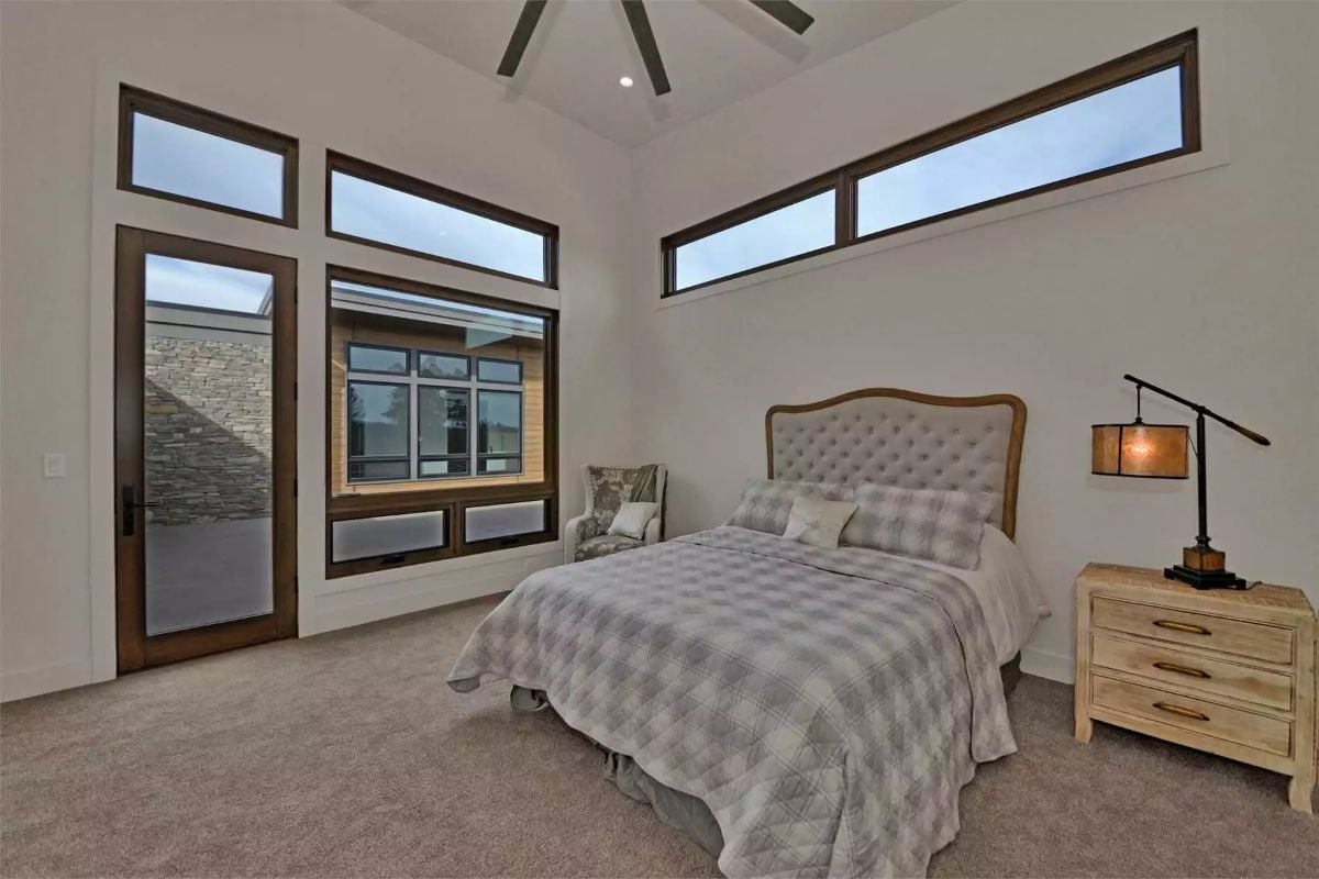 Clerestory Windows, Tufted Headboard, and Light That Doesn't Need Help