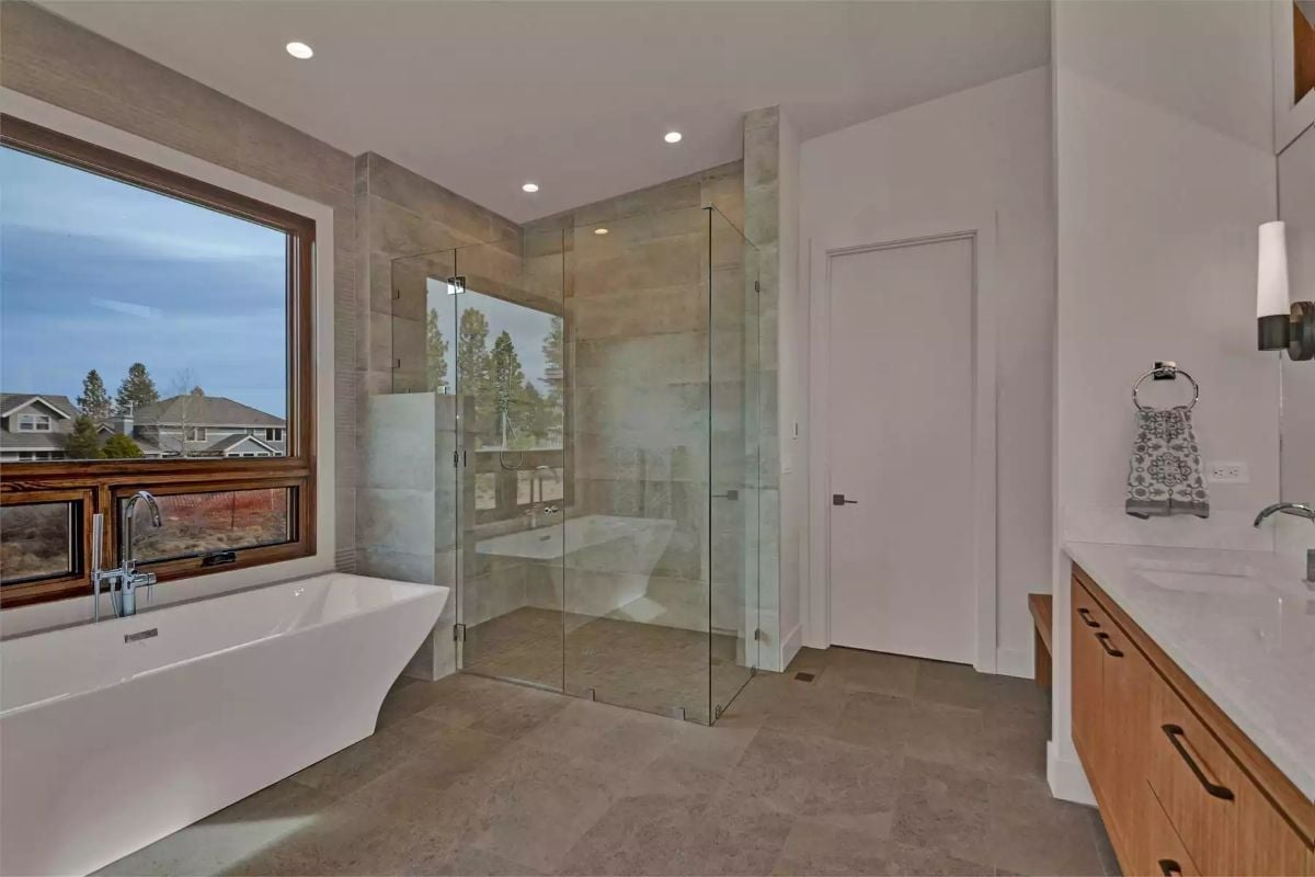 Freestanding Tub by the Window, Glass Shower Behind It