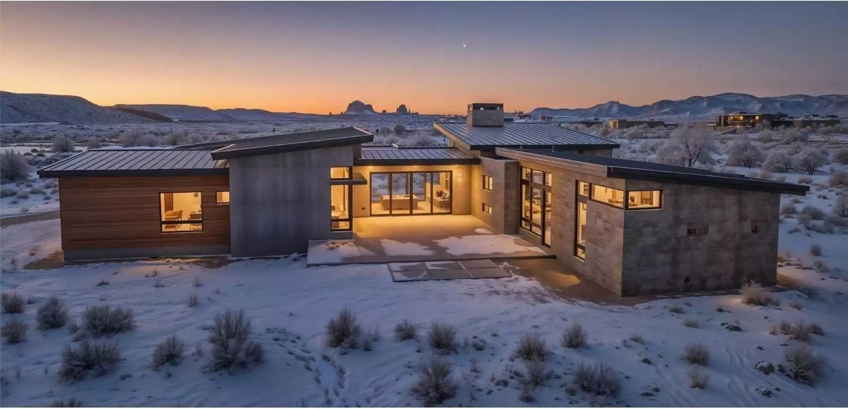 Snow-Dusted Desert Build Where Warm Light Cuts Through a Cold Evening
