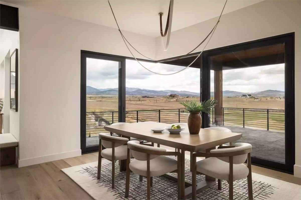 Corner Glass and Open Prairie Make the Dining Room Feel Borrowed from Outside