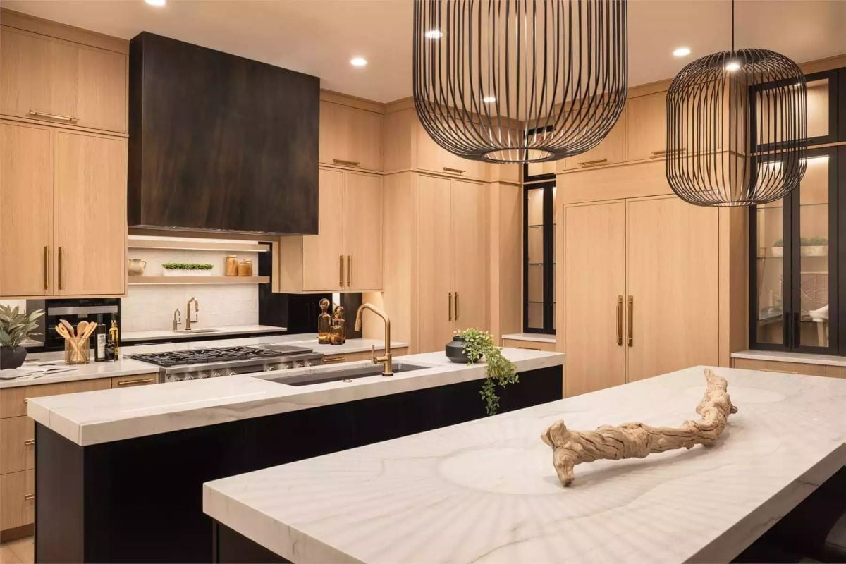 Sculptural Pendant Lights Do the Heavy Lifting Above Marble and Light Oak