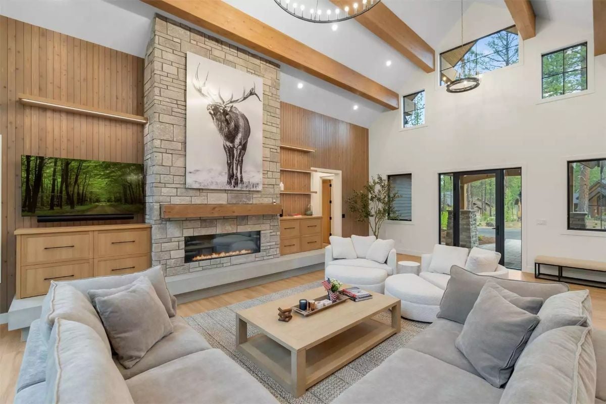 Vaulted Ceilings, Exposed Beams, and a Stone Fireplace That Commands the Room