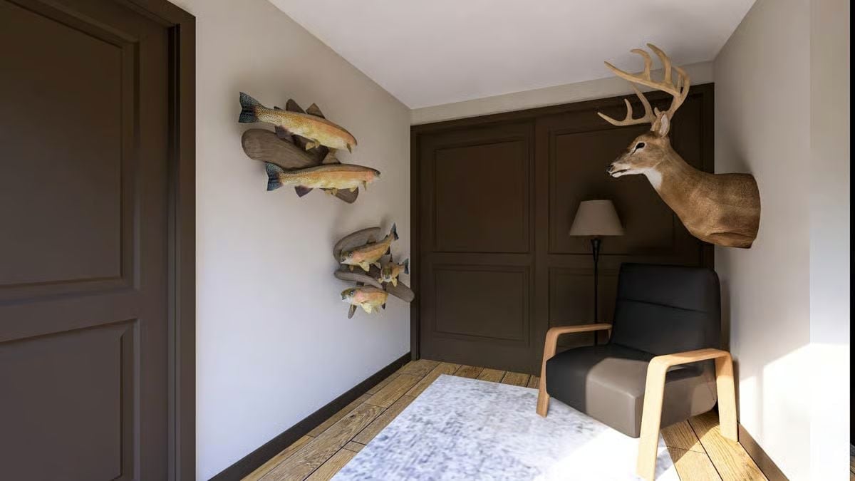 Mounted Fish and a Buck Above the Chair Make This Den Feel Like a Trophy Room That Lives