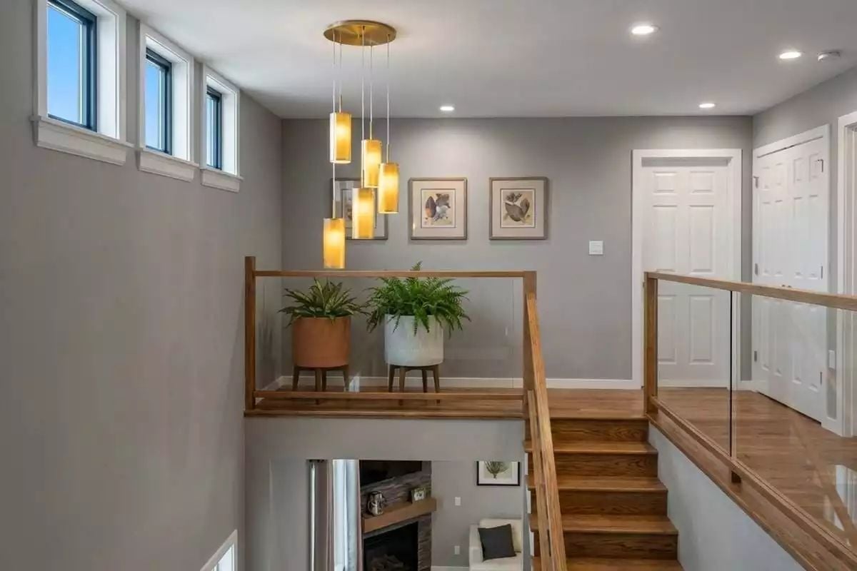Pendant Cluster, Glass Rail, and Ferns That Actually Belong Here