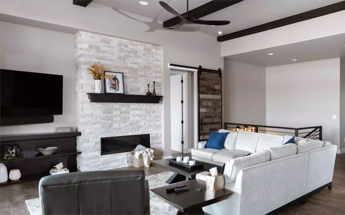White Stacked Stone Fireplace That Goes All the Way to the Ceiling