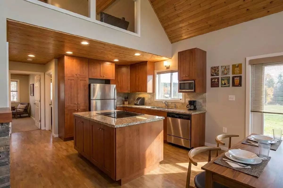 Cherry Cabinets and Granite Counters Make the Kitchen Worth Lingering In