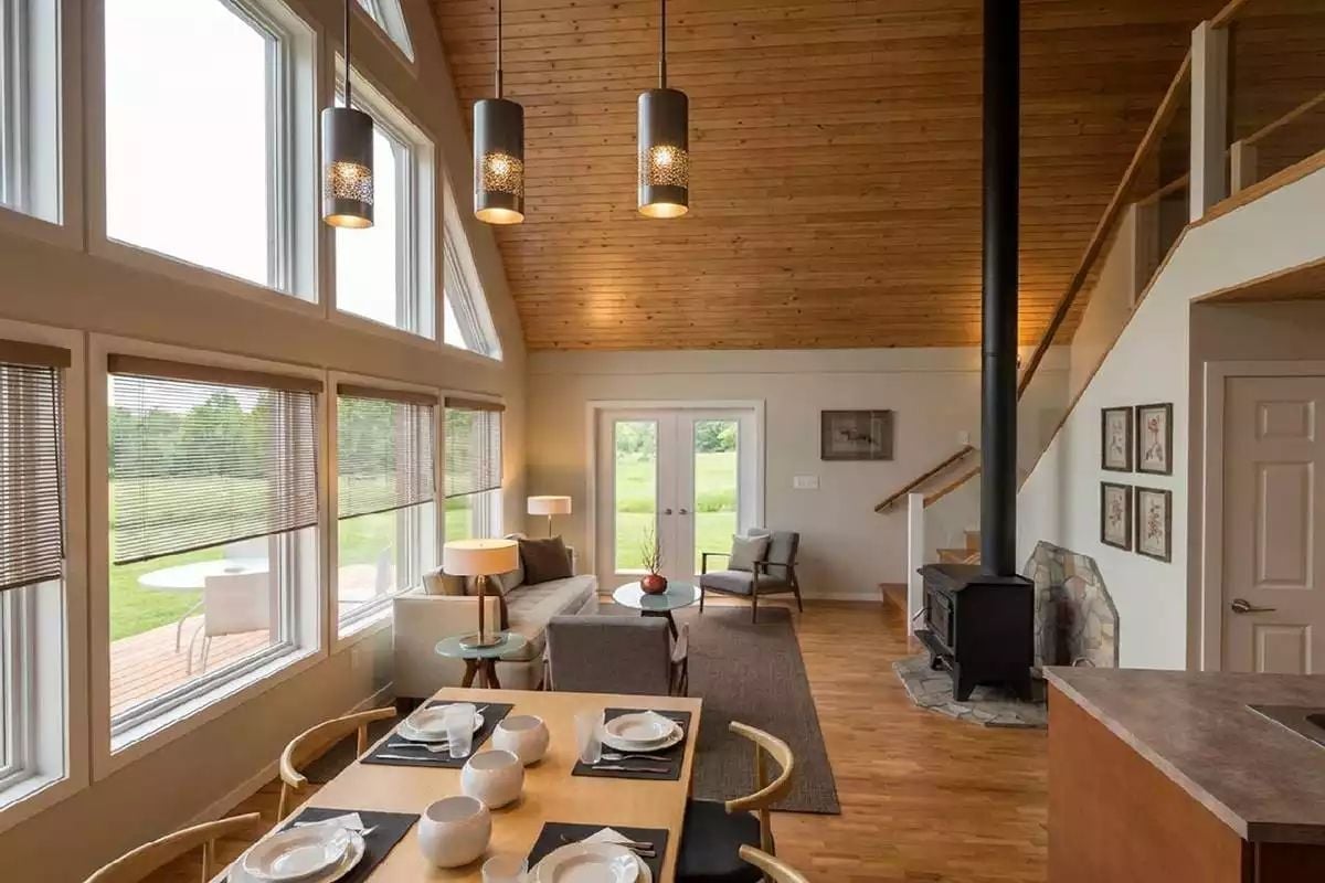 Pendant Lights and a Wood Stove Make This Great Room Feel Like a Basecamp