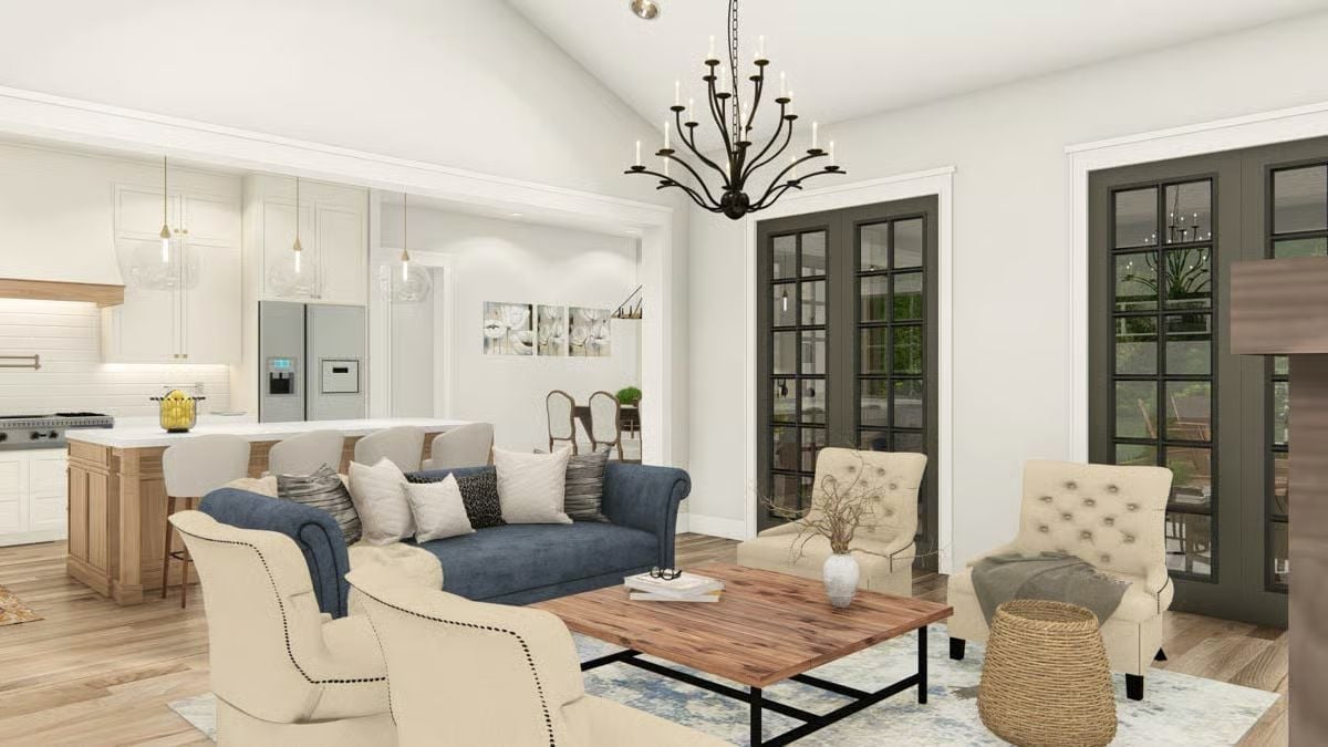 Cream Chairs, Blue Sofa, and a Chandelier That Means Business