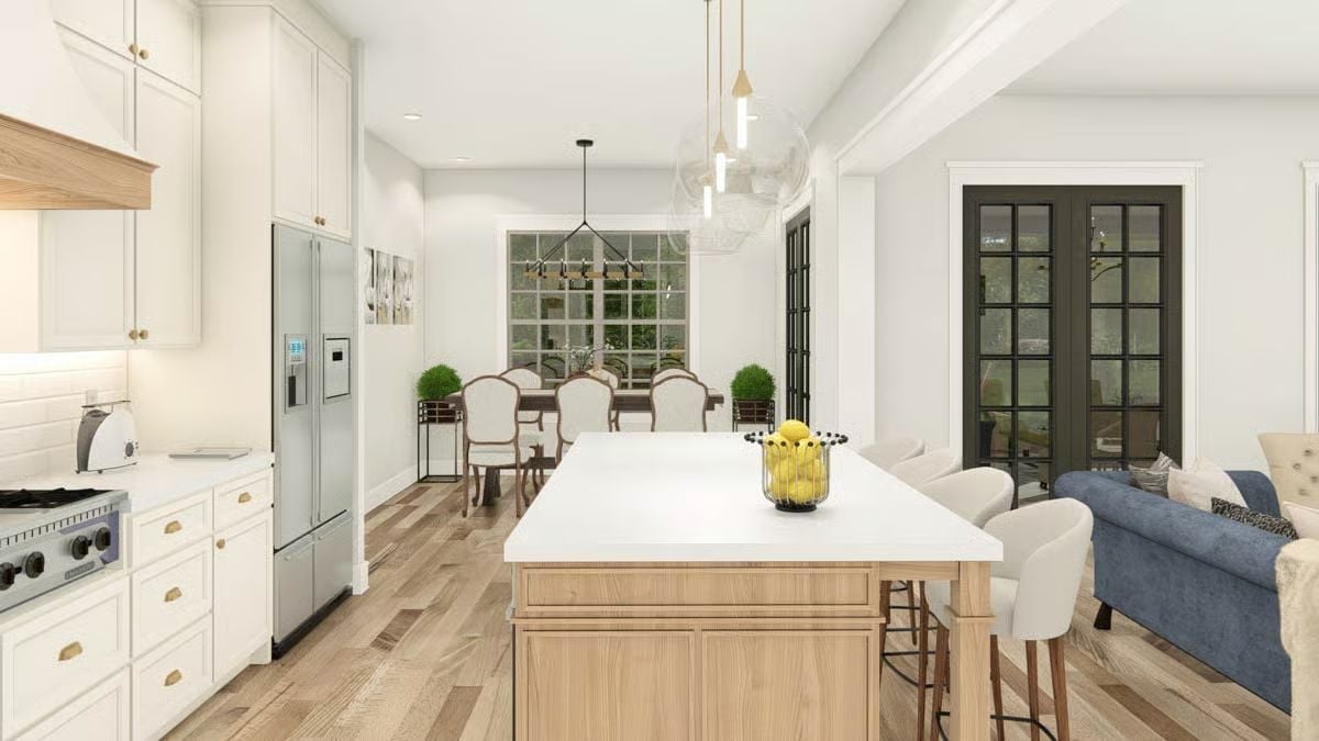 Light Wood Island Base in an All-White Kitchen Earns Its Keep