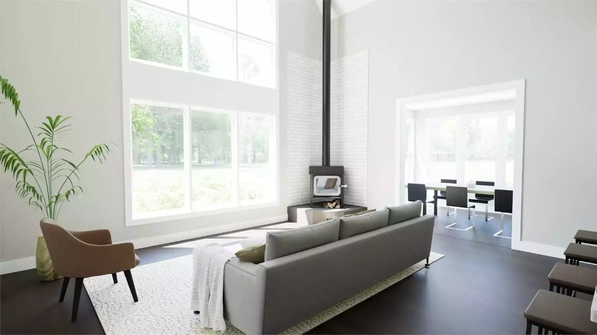 Midday Sun Through Double-Height Windows Makes This Fireplace Corner Work Harder