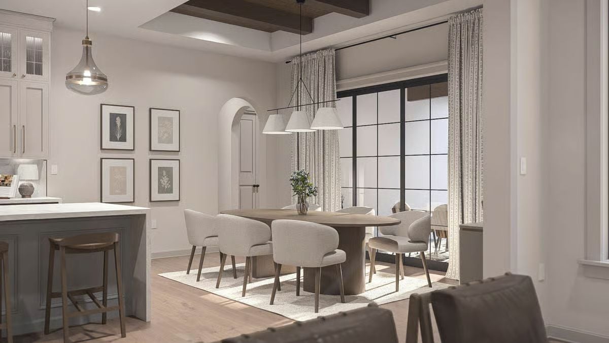 Oval Pedestal Table Under Triple Pendants Does the Heavy Lifting Here
