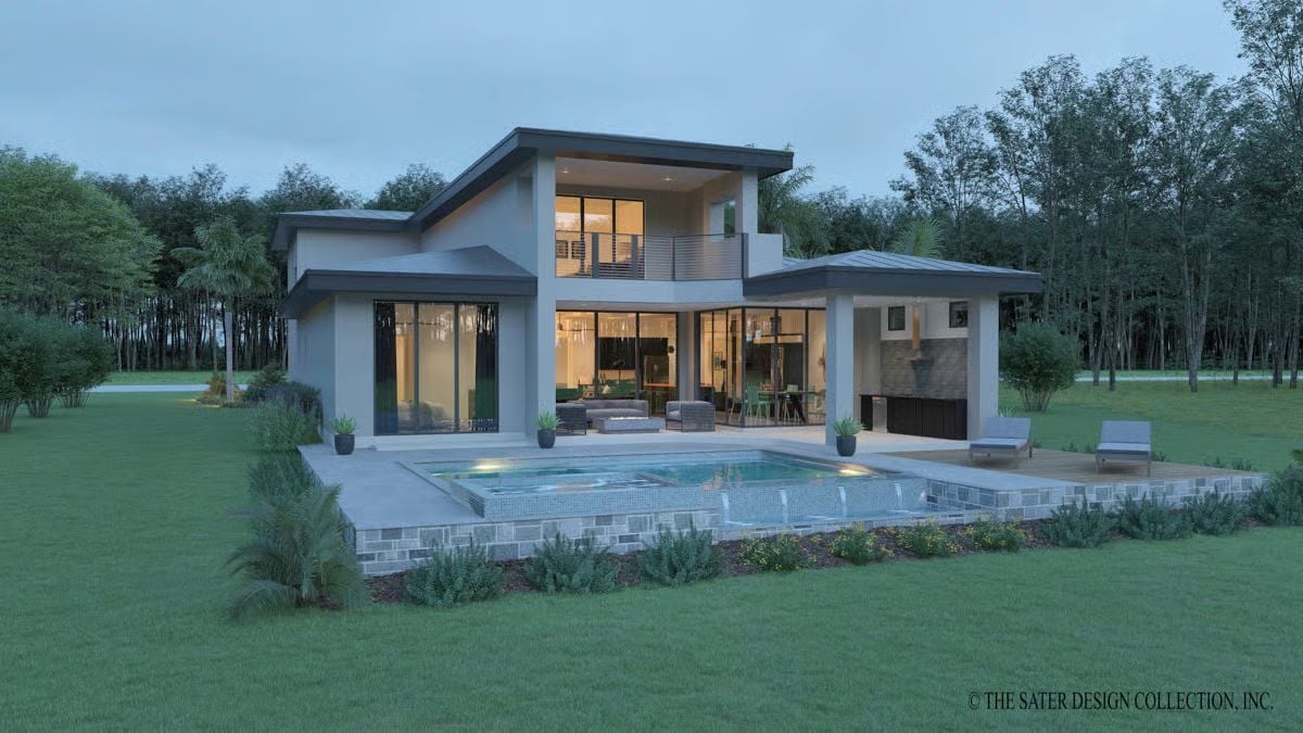 Elevated Pool Deck Spills Water Over Stone Edges Into the Lawn Below
