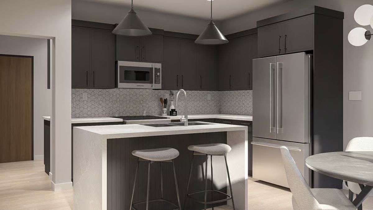 Dark Shaker Cabinets and a Waterfall Island That Actually Earns the Square Footage