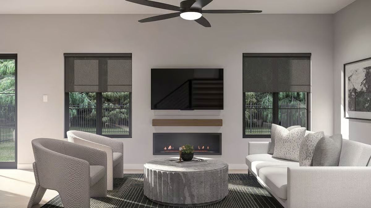 Fluted Stone Table, Linear Fireplace, and Zero Clutter Make This Room Feel Earned