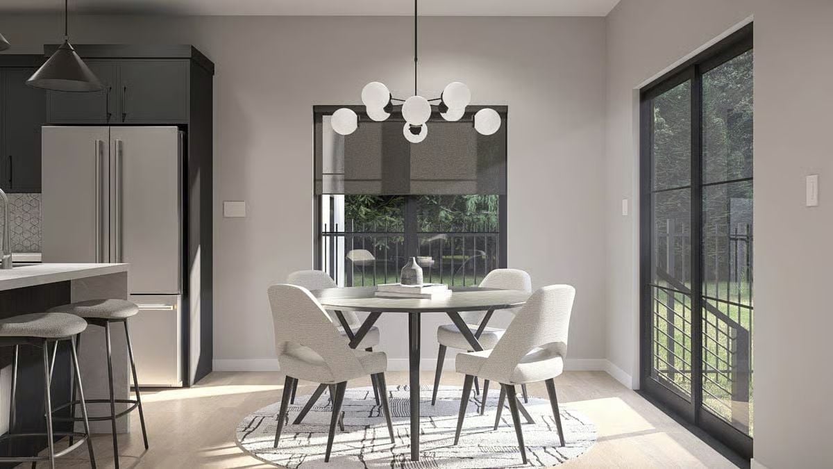 Globe Chandelier, Round Table, and a Sliding Door That Pulls the Backyard In
