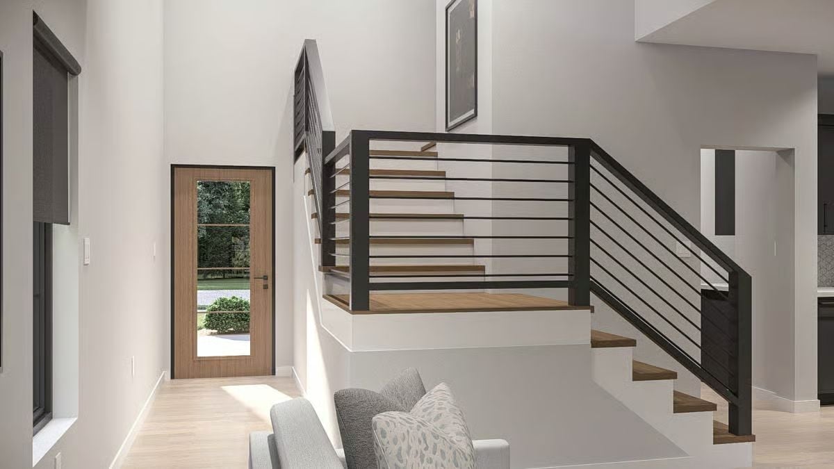 Open-Riser Treads and Horizontal Steel Rail Make a Case for the Foyer