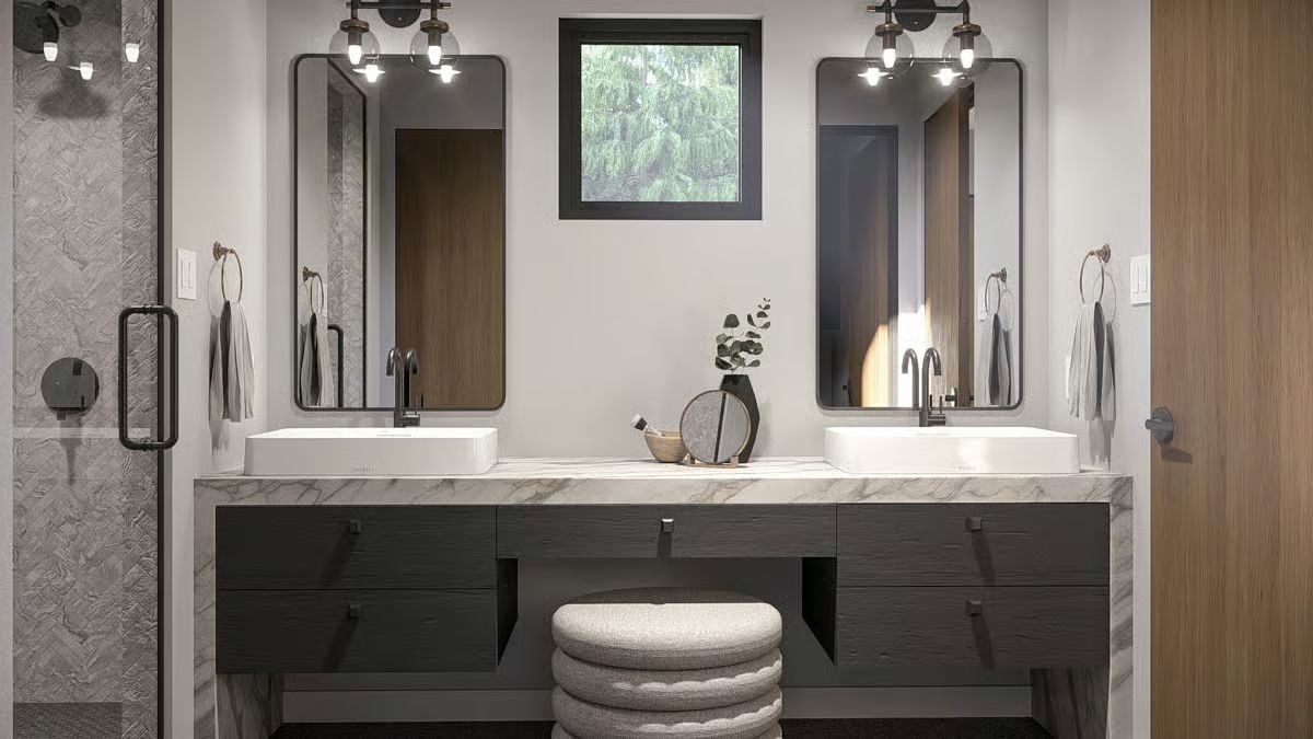 Vessel Sinks, Marble Counters, and Two Mirrors That Frame the Window Between Them