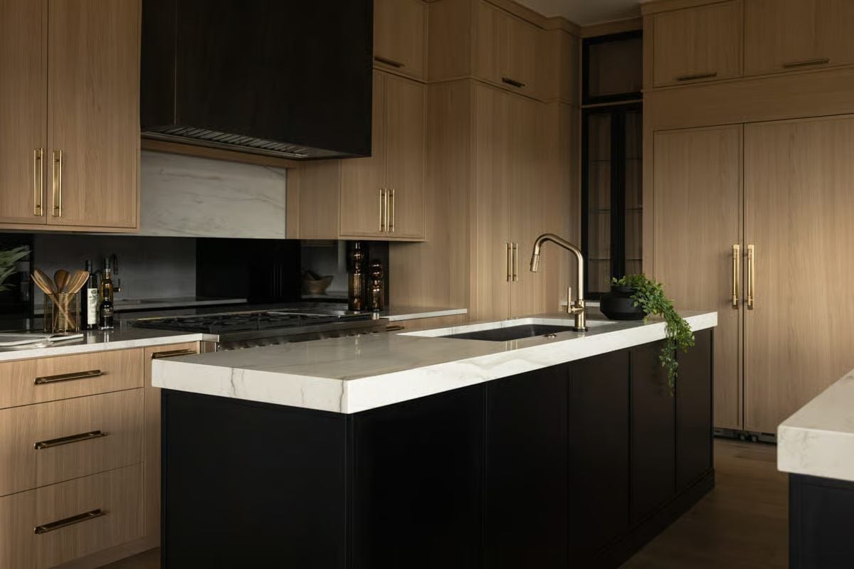 Black Island Base, Marble Slab Top, and Brass Fixtures That Mean Business