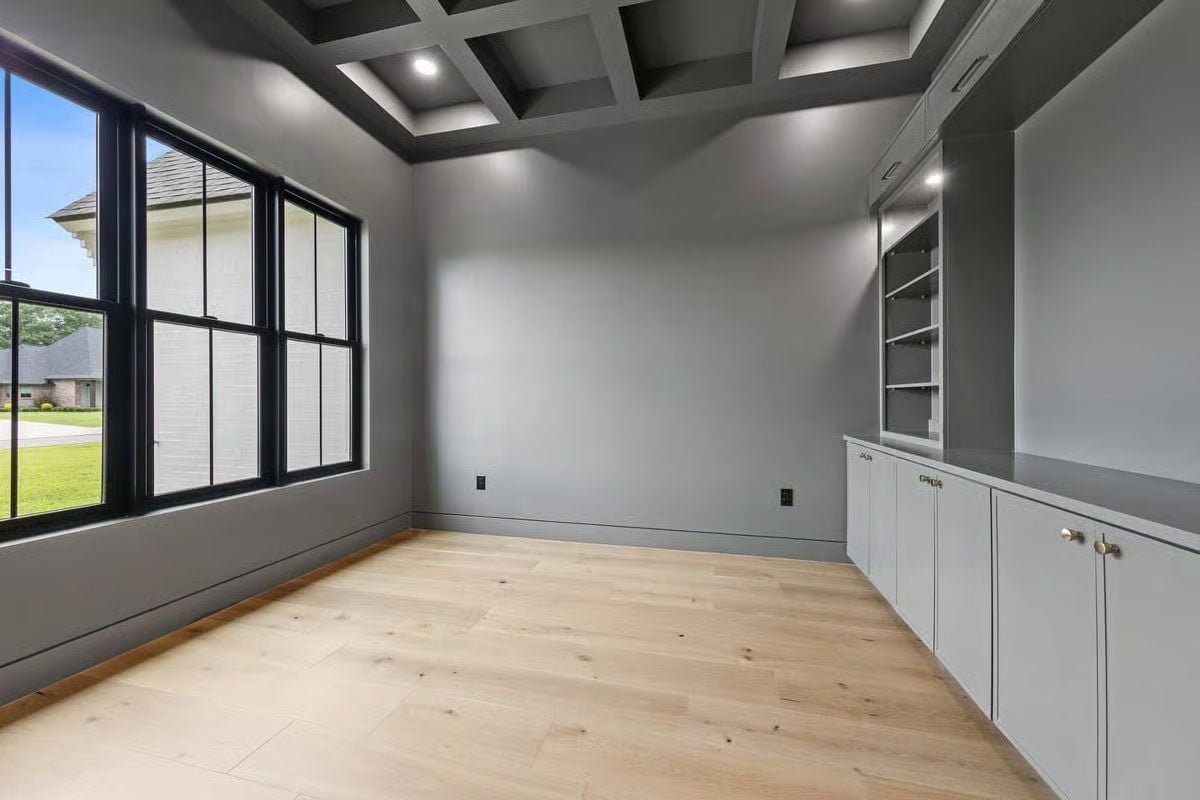 Coffered Ceiling, Built-In Shelving, and Light Wood That Pulls It All Down to Earth