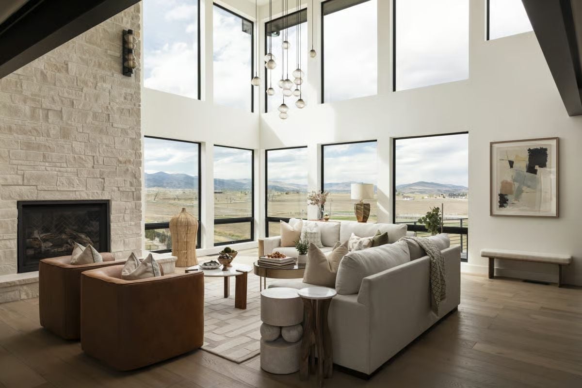Double-Height Glass and a Stone Fireplace Wall Built for Wide-Open Country Views