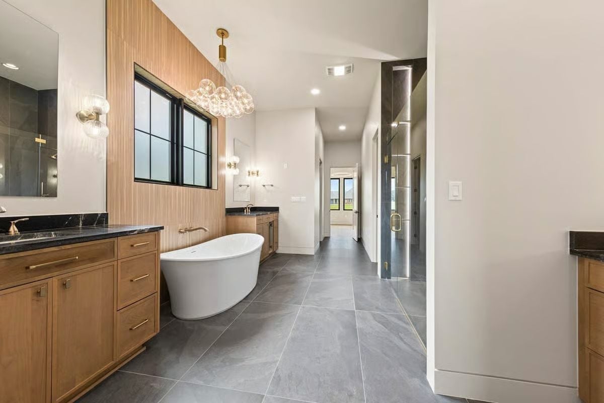 Fluted Wood Wall, Bubble Chandelier, and a Soaking Tub That Earns the Square Footage