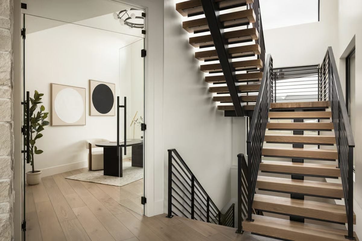 Open-Riser Treads, Horizontal Steel Rails, and Natural Light Pouring From Above