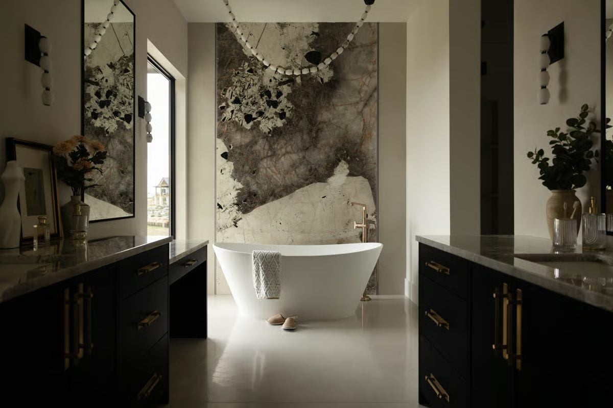 Sculptural Soaking Tub Anchored by a Slab of Veined Stone Nobody Forgets