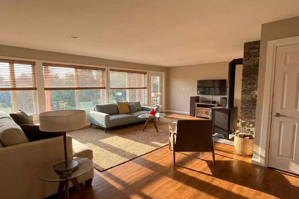Wood-Burning Stove and Afternoon Sun Turn This Living Room Into the Real Amenity