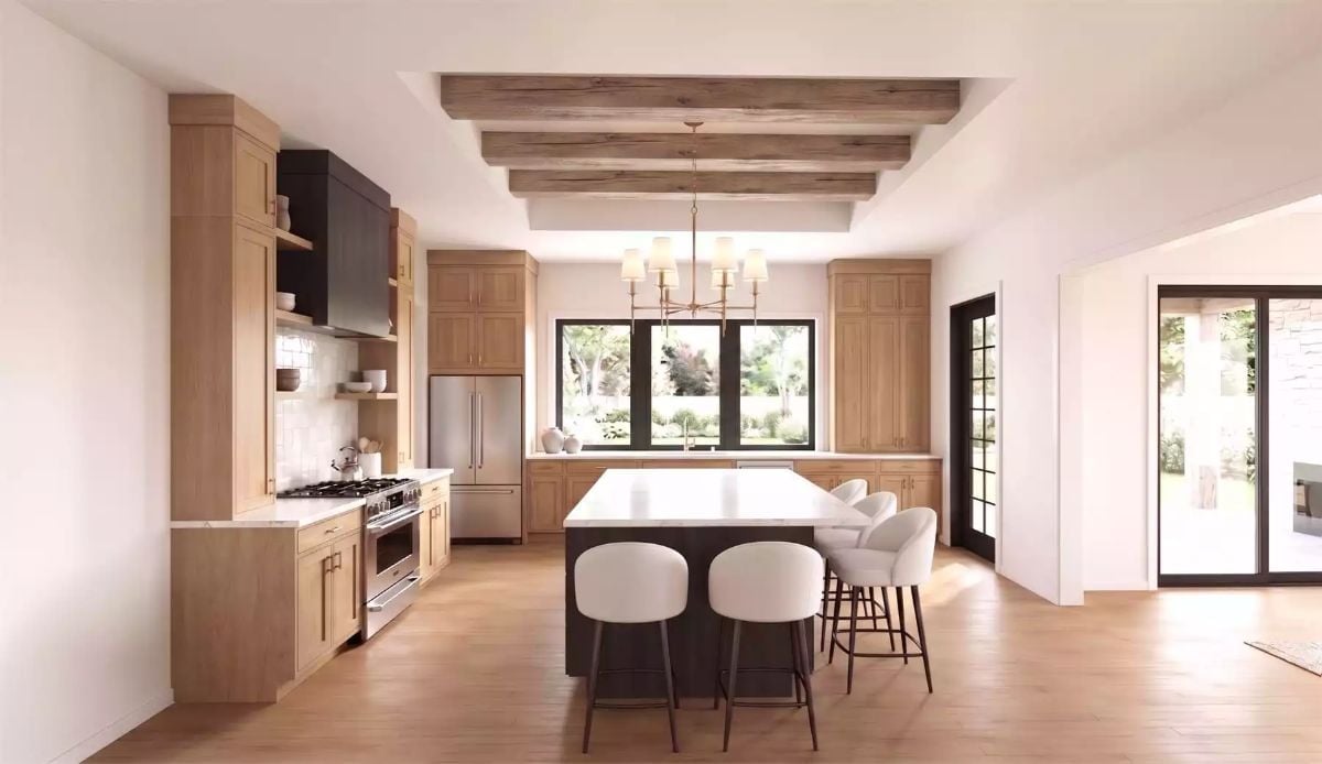 Exposed Ceiling Beams and a Dark Island Base That Pull the Room in Two Good Directions