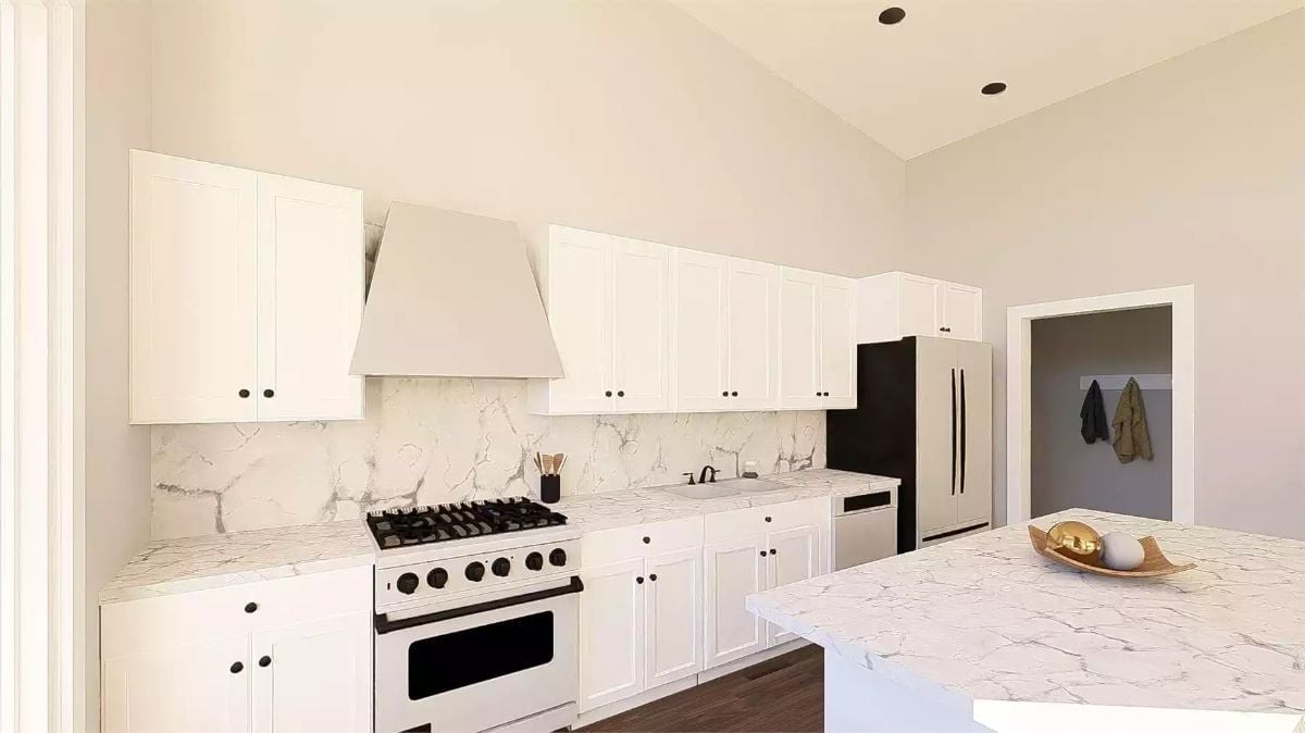White Quartz, Black Hardware, and a Range Hood That Earns Its Square Footage