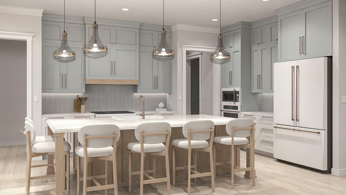 Sage Cabinets and a Fluted Island Base Make This Kitchen Worth Lingering In